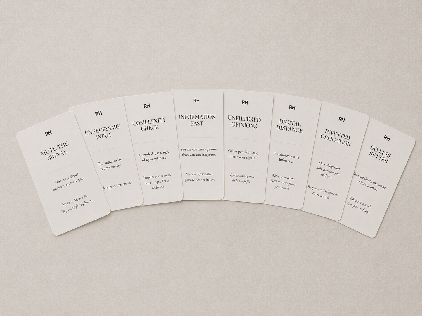 Set of white cards with black text on a beige background