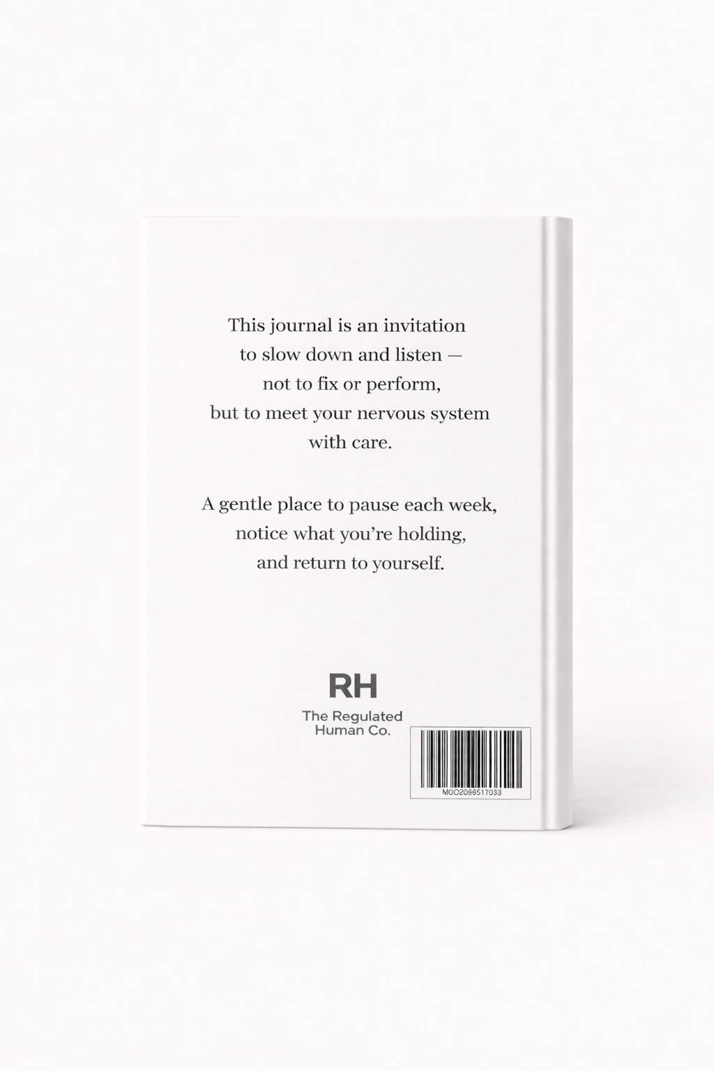 White journal with text and a barcode on a white background