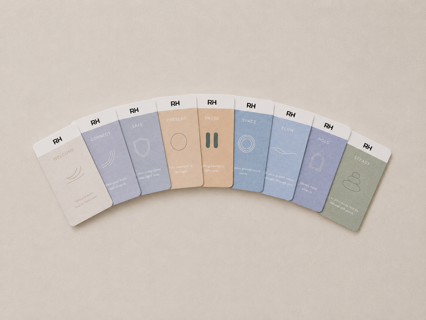 Set of RH cards product boxes arranged in a semi-circle on a beige background