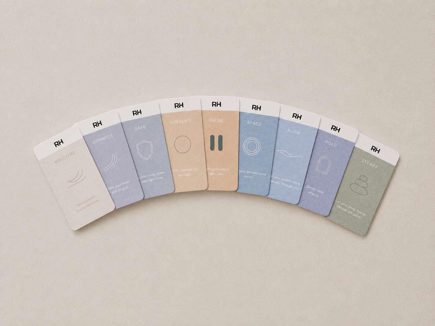 Set of RH cards product boxes arranged in a semi-circle on a beige background